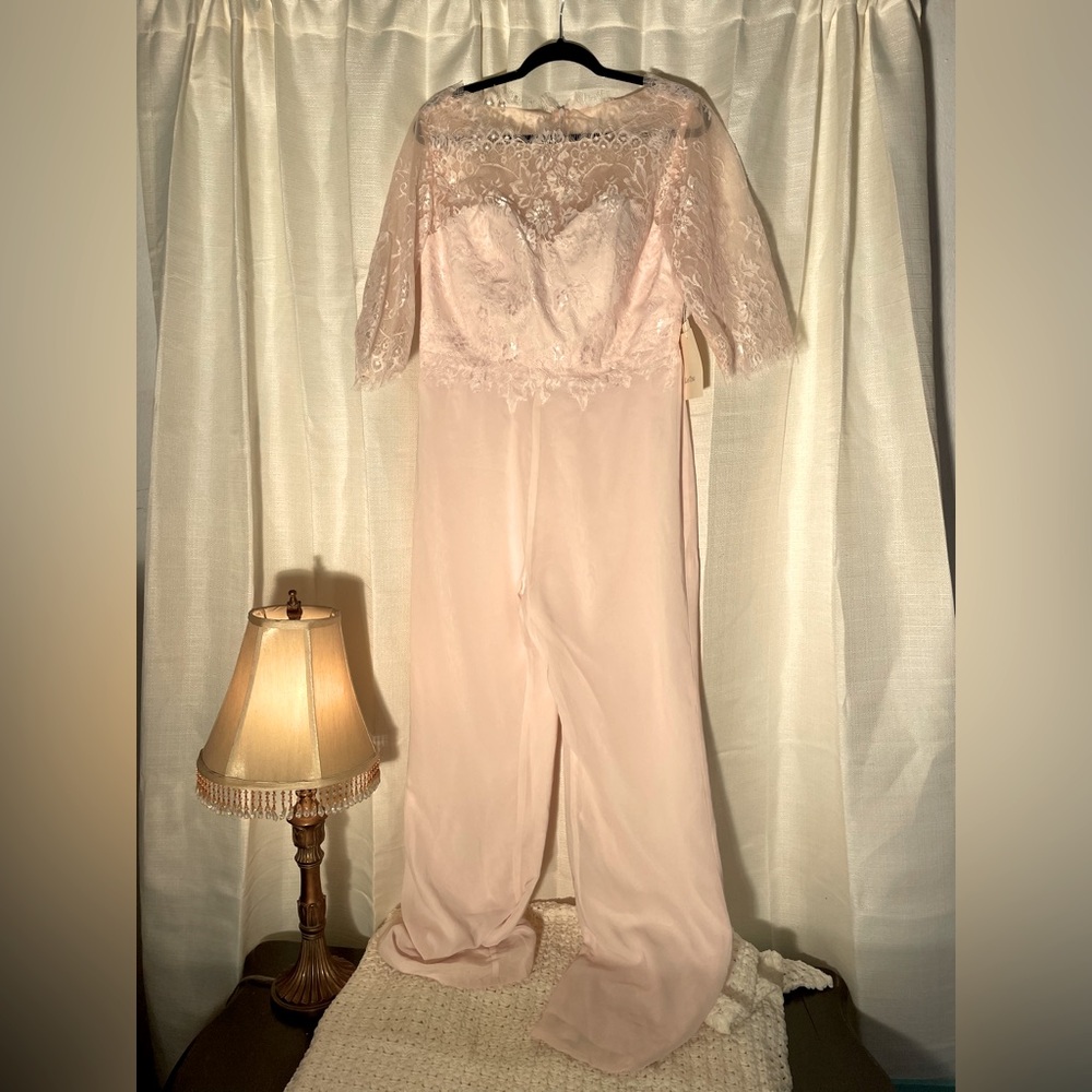 Stunning blush pink jumpsuit. Size 16 but fits smaller. The brand is LanTing.